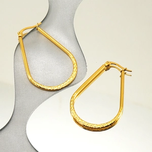 Minimalist golden stainless steel oval hoop earrings with textured finish for women