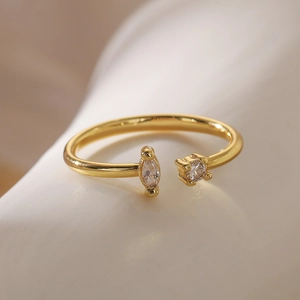 Macro shot of 18K gold plated copper ring with marquise and round cut zircon gems