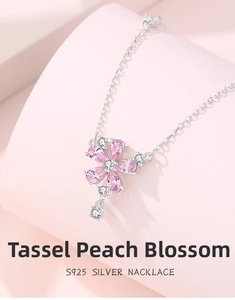 Macro shot of S925 silver necklace with pink peach blossom tassel and zircon petals