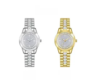 Macro detail of luxury women's wristwatches in silver and gold with full diamond setting