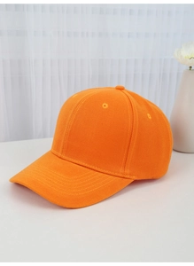 Detail view of orange cotton baseball cap showing soft twill texture and breathable eyelets
