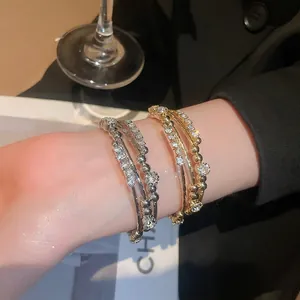 Multi-layer geometric open cuff bracelet set with sparkling diamonds in gold and silver finish