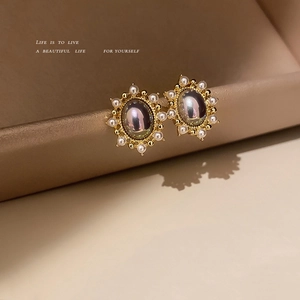 Vintage oval earrings with iridescent stone and white pearl halo in gold setting