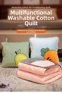 Detail of soft washed cotton fabric on 2-in-1 cushion and blanket with fruit patterns