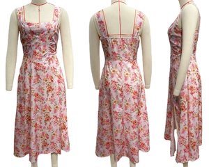 Three-way view of pink floral midi dress with square neckline and waist slit details