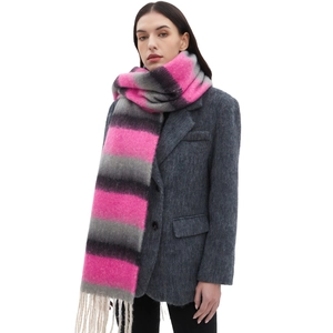 Cozy pink and grey striped scarf with tassels shown on model against white background