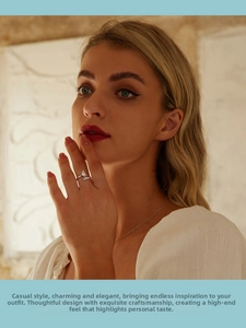 Close-up of S925 sterling silver open ring featuring teardrop crystals on model's hand