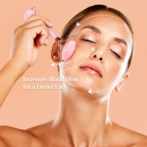 Macro view of rose quartz facial roller massager showing firming benefits on face