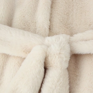 Faux fur coat for women featuring a belted waist in soft cream white plush texture