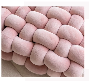 Detail of pink woven velvet pillow cover showing rich fabric texture and soft craftsmanship