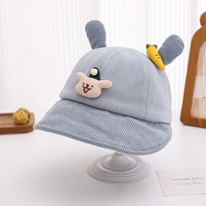 Detail of light blue corduroy kids bucket hat featuring cute cartoon bear and rabbit ears