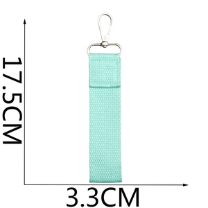 Detailed size specifications of the mint green fabric wristlet strap with silver metal clasp
