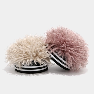 Winter knitted beanie hats with curly afro faux fur in cream and lotus pink colors