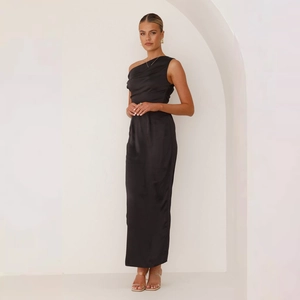 Detail of elegant black one-shoulder satin dress featuring a cinched pleated waistline