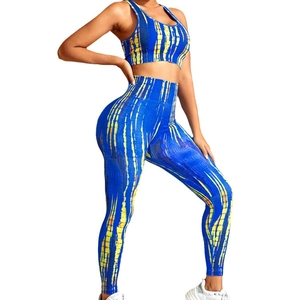 Blue and yellow tie-dye seamless yoga set featuring racerback top and high waist leggings