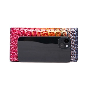 Detail of colorful gradient crocodile texture wallet with smartphone size comparison