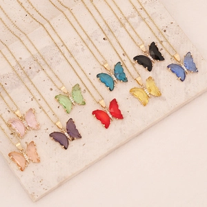 Golden butterfly pendant necklace set in nine colors featuring crystal wings and dainty chains