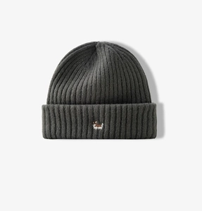 Close-up of dark grey ribbed knit beanie featuring a cute embroidered corgi dog detail