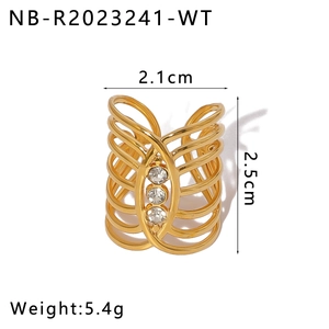 Detail view of hollow gold ring with three round cubic zirconia and geometric lines