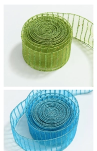 Detailed view of green and blue Christmas sheer ribbons with glitter stripes for trees