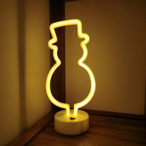 Neon snowman LED desk lamp with white base emitting warm yellow light for holiday decor
