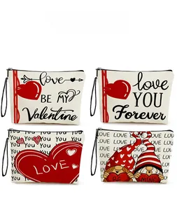 Detail view of four canvas makeup bags with Valentine hearts and gnome print patterns