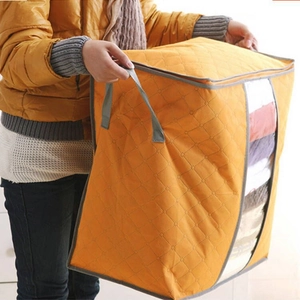 Quilted orange non-woven storage bag for clothes with clear window and handles