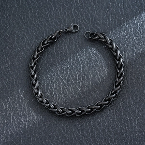 Detailed view of black stainless steel wheat chain bracelet featuring lobster clasp