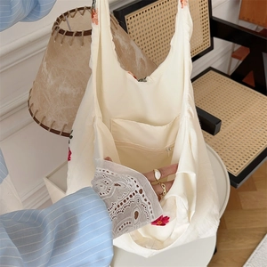 Detailed interior of floral canvas tote bag featuring a secure zipper inner pocket