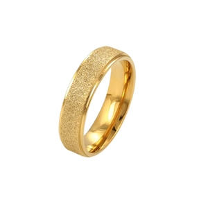 Detailed view of a gold-toned titanium steel ring with a frosted sandblasted texture