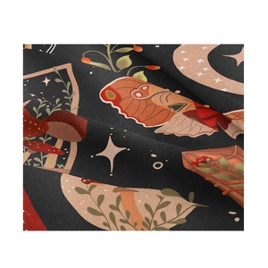 Macro view of forest tapestry showing moths, mushrooms and crescent moon patterns