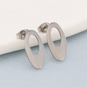 Close-up of silver geometric hollow oval earrings with stainless steel posts