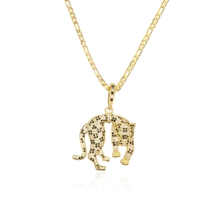 Macro detail of gold-plated leopard pendant with cubic zirconia on Figaro chain
