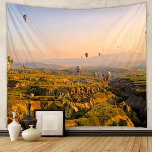Detail of bohemian tapestry featuring colorful Cappadocia hot air balloons at sunrise