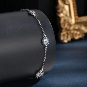 Elegant 925 sterling silver evil eye bracelet with sparkling blue and white zircon stones