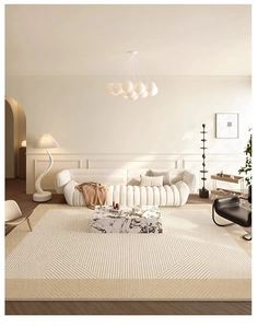 Modern French style geometric cream rug in a cozy living room with sofa and marble table