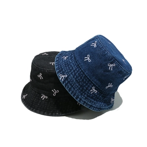 Women's denim bucket hats in black and navy blue with white bow embroidery