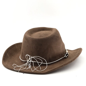 Detail of brown suede cowboy hat featuring white rope trim and decorative beads