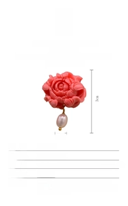 Detail view of pink flower S925 silver earrings with natural baroque pearl drops