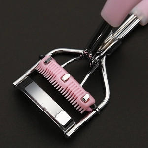 Pink and silver metal eyelash curler with built-in comb for natural curling results