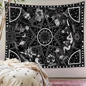 Gothic zodiac tapestry with black and white astrology symbols in a cozy bedroom scene