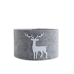 Grey felt Christmas tree collar with white reindeer applique on a clean white background