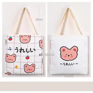 Detail of cute canvas tote bag showing front and back bear prints with size dimensions