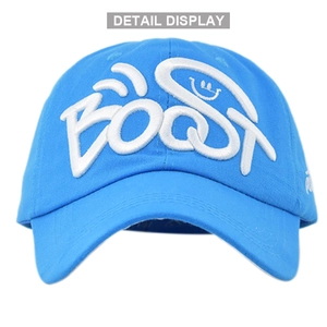 Close-up detail of white 3D BOOST embroidery on a bright blue baseball cap