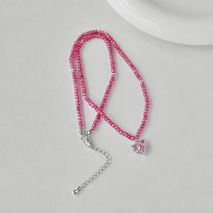 Pink faceted bead necklace with silver accents and a heart-shaped gemstone pendant detail
