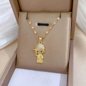 Golden hat boy pendant necklace with sparkling cubic zirconia in a jewelry box