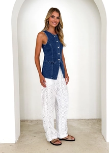 Chic retro denim vest paired with white lace wide-leg trousers for a stylish summer street look