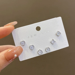 Three-pair silver stud earring set with heart, round, and square geometric zircons