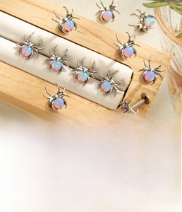 Detailed view of titanium spider stud with opal inlay and 1.2x8mm threaded post size