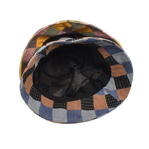 Detail view of plaid bucket hat featuring breathable mesh lining and adjustable drawstring